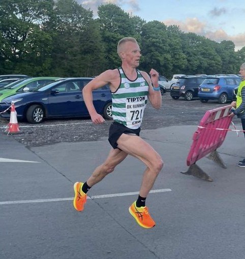 Tipton Harriers runner filmed side on mid-stride, the view used in a running form analysis